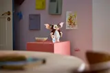 Gizmo on a pink pedestal.