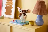 Gizmo on a yellow dresser.