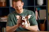 Man holding LEGO Gizmo.