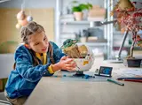 Child building Grogu hover pram