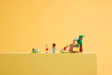Full LEGO set on yellow backdrop.