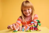 Child playing with LEGO set.