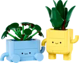 Two cheerful LEGO potted plants with unique leaf designs.