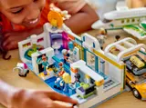 Child interacting with airport terminal interior.