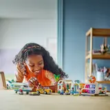Child playing with LEGO Friends airport set.