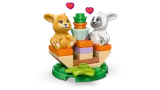 Close-up of bunnies on their feeding station.