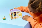 Child interacting with the Bunny Hotel interior.