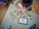 Child building Candy Store with digital instructions.