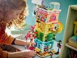 Child playing with LEGO Friends Community Center.