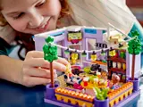 Child playing with LEGO Friends Kitchen.