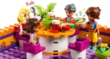 Minifigures dining on LEGO rooftop.