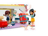 Friends dancing by the jukebox.