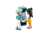 Minifigures playing arcade game.