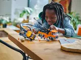 Child playing with LEGO Tow Truck