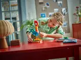 Child playing with LEGO Heihei.