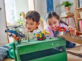 Kids playing with LEGO vehicles.