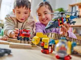 Kids playing with custom LEGO vehicles.
