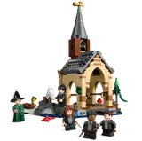 Boathouse from side, minifigures on land.
