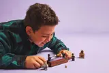 Child playing with Dueling Club set.