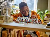 Person playing with LEGO Potions Class set.