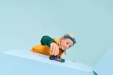 Child playing with LEGO hot rod.