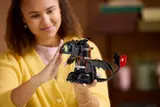 Person posing LEGO Toothless.