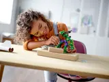 Child playing with Hulk Mech.