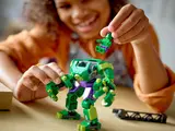 Child placing minifigure into mech.