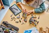 Child building LEGO Star Wars 75451 with digital instructions.