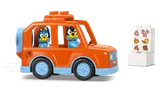 Bluey and Bingo in their LEGO Duplo van.