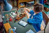 Child building LEGO Pirate Ship.