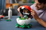 Man admiring open Poké Ball.
