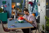 Man with completed Poké Ball.