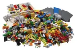 Massive assortment of LEGO bricks, animals, and minifigures.