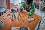 Person building LEGO AT-AT Walker.