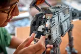 Builder adding interior AT-AT part.