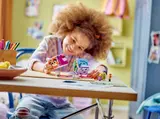 Child playing with Inside Out 2 Mood Cubes.