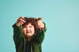 Child playing, aiming