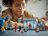 Child playing with Iron Man station.