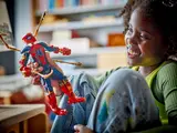 Child playing with Iron Spider-Man.