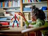 Child posing Iron Spider-Man.