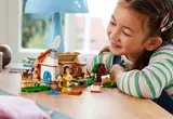 Girl smiling while playing with the set.