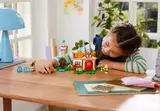 Girl playing with the LEGO set.