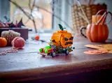 LEGO Halloween truck in festive room.