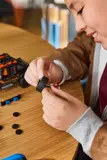 Assembling a LEGO wheel.