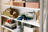Starship on white shelf.