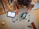 Child building with digital instructions.