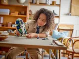 Child playing with Jango Fett's Starship.