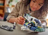 Child inspecting details on Jango Fett's Starship.