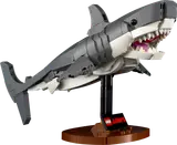 Brick-built shark model on a display stand.